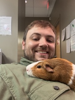 Dr. Kopp with a guinea pig